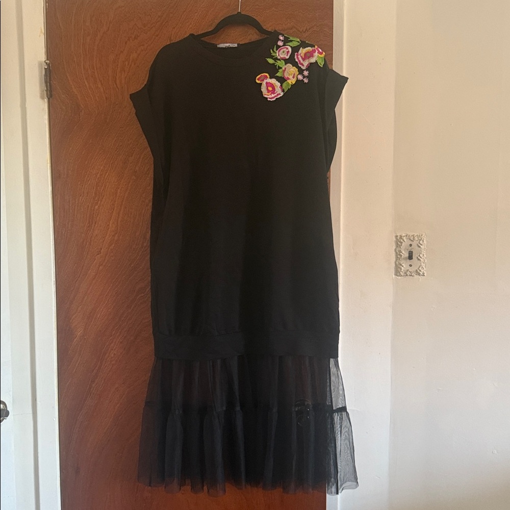 Elegant Black Dress with Floral Accent